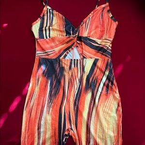 Orange and black romper. Size XS but fits like SMALL. Brand: SHEIN
